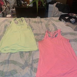 Two RacerBack So Tanks Size XS but fit like Small - Medium